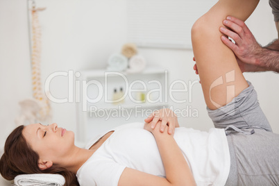 Peaceful patient being stretched by a doctor