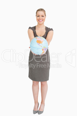 Businesswoman showing a globe