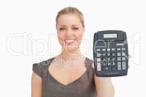 Woman showing a calculator in her hand