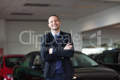 Dealer standing in front of a car