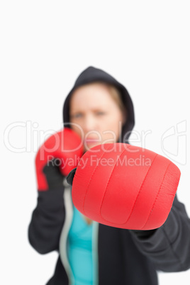 Woman boxing with a red gloves