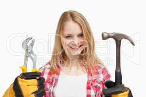 Woman holding tools while standing
