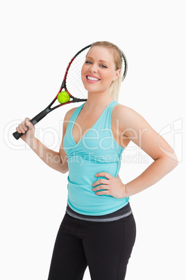 Woman holding a racquet behind her head