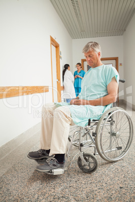 Patient in a wheelchair closing eyes