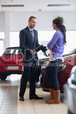 Salesman talking to a customer