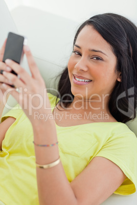 Portrait of a Latino holding her smartphone