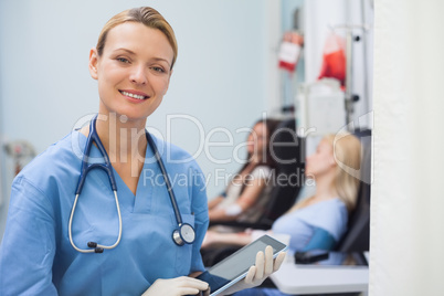 Nurse using a tablet computer