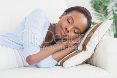 Black woman sleeping while lying on side