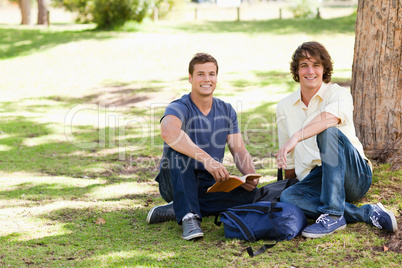 Two male students posing while studying