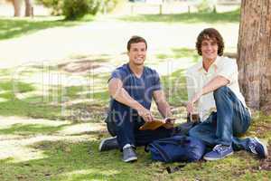 Two male students posing while studying