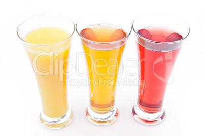 Three glasses full of fruit juice