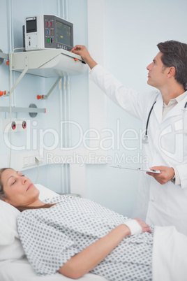 Doctor adjusting a monitor