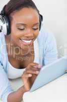 Black woman touching a tablet computer