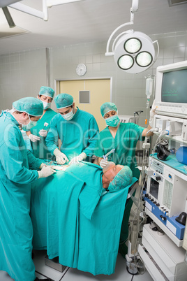 Nurse holding a mask on a patient