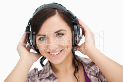 Blue eyed woman wearing headphones