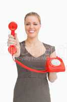 Woman showing a retro phone