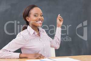 Black teacher showing the blackboard