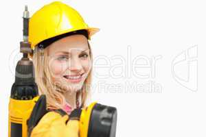 Young woman holding an electric screwdriver