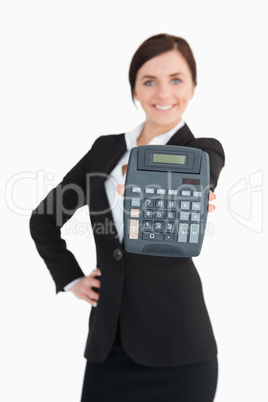 Happy businesswoman in black suit showing a calculator