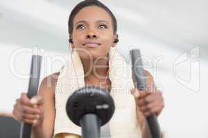 Low angle view of a black woman doing exercise bike