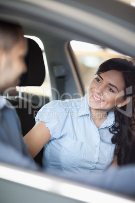 Woman smiling in a car