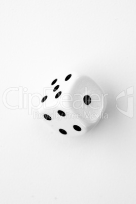 Black and white dice in motion