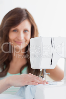 Woman using a sewing machine