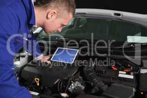 Mechanic checking an engine