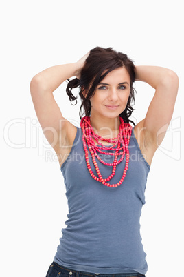 Brunette posing with a red bead necklace