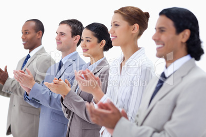 Close-up of a business team smiling and applauding