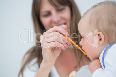 Mother feeding to a baby