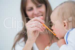 Mother feeding to a baby