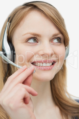 Close up of a woman with headset looking up