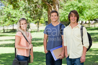 Portrait of a girl in front of two students