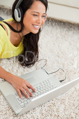 Close-up of a happy Latin chatting on a laptop