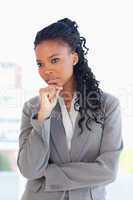 Businesswoman looking towards the side with her hand on her chin