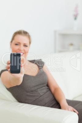 Woman showing a screen of a smartphone