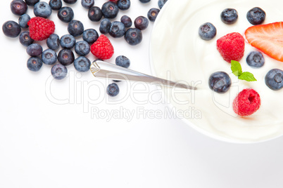 Dessert of berries with cream