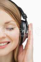 Close up of a woman listening music