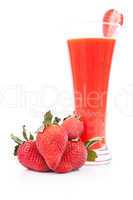 Strawberries in front of a full glass