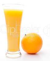 Orange next to a glass of orange juice