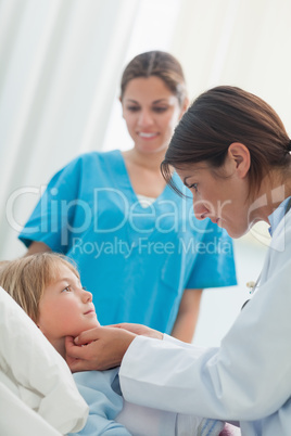 Doctor auscultating a child