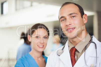 Doctor and nurse looking at camera