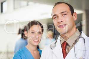 Doctor and nurse looking at camera