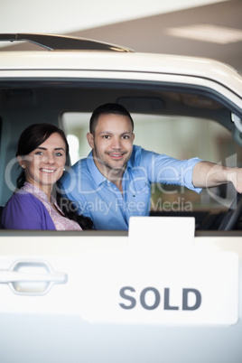 Couple in a sold car