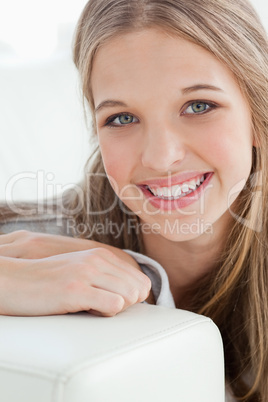 Close up of a smiling girl as she looks at the camera