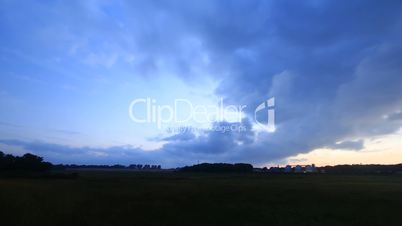 Landscape with fast moving clouds - Time Lapse