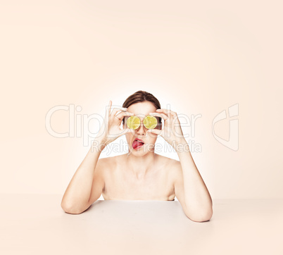 Playful woman with fruit eyes