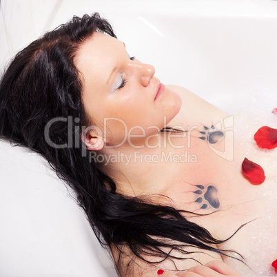 Young woman in wellness in the bathtub