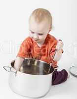 baby with big cooking pot